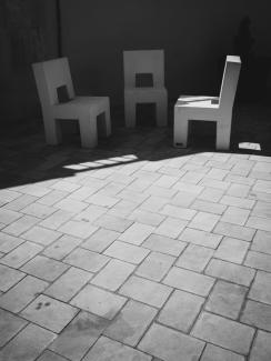 Stone chairs in the main square of Cervià de Les Garrigues, Catalonia